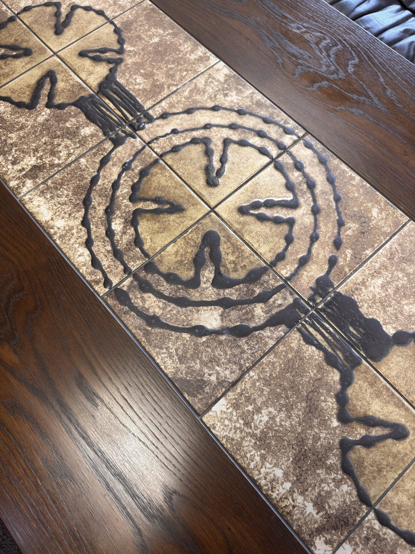 tessvintage Danish extendable dining table by Poul Poulsen featuring earthy ceramic tiles with graphic circle motifs