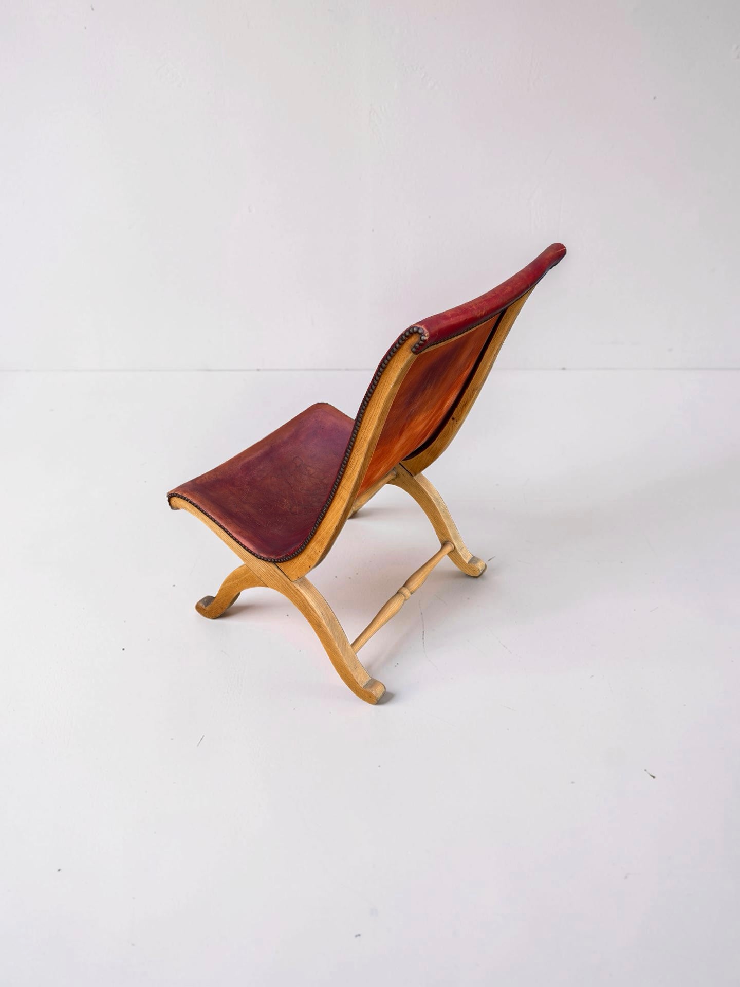 Slipper chair van rood leer van Pierre Lottier voor Valenti