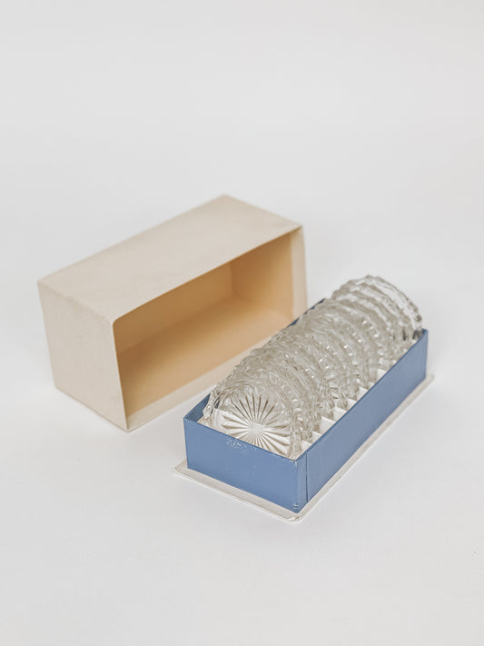 Set van 12 vintage kristalglazen onderzetters