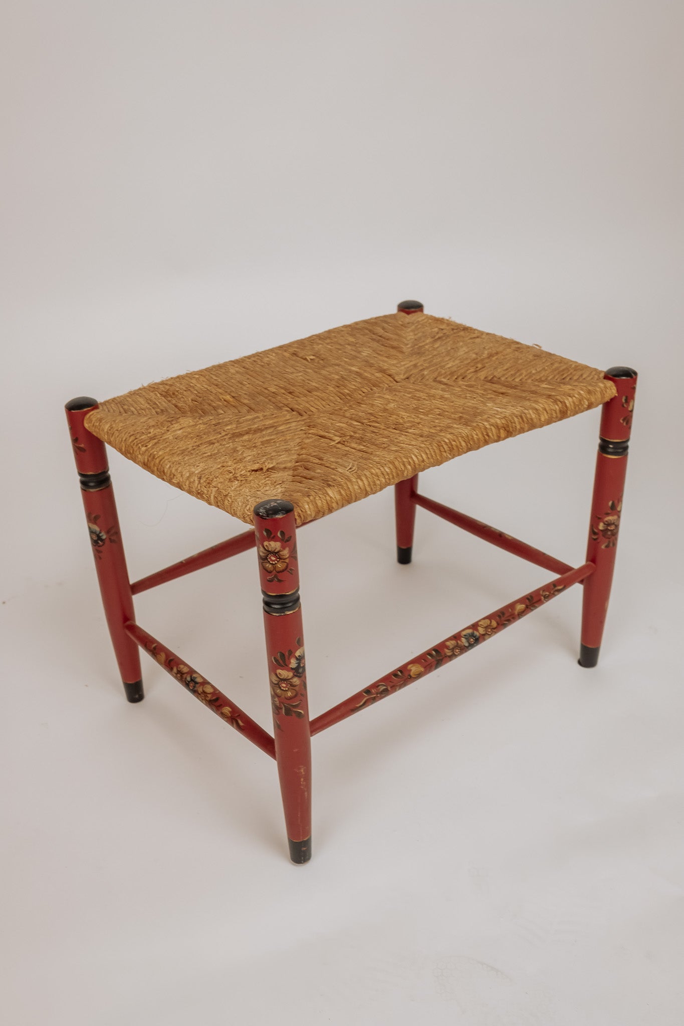 Wooden stool with burgundy papercord seat