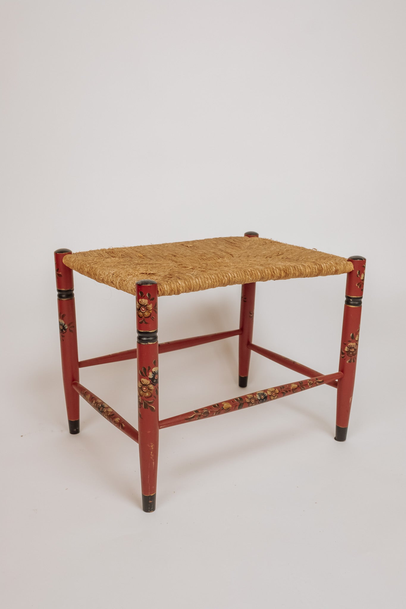 Wooden stool with burgundy papercord seat