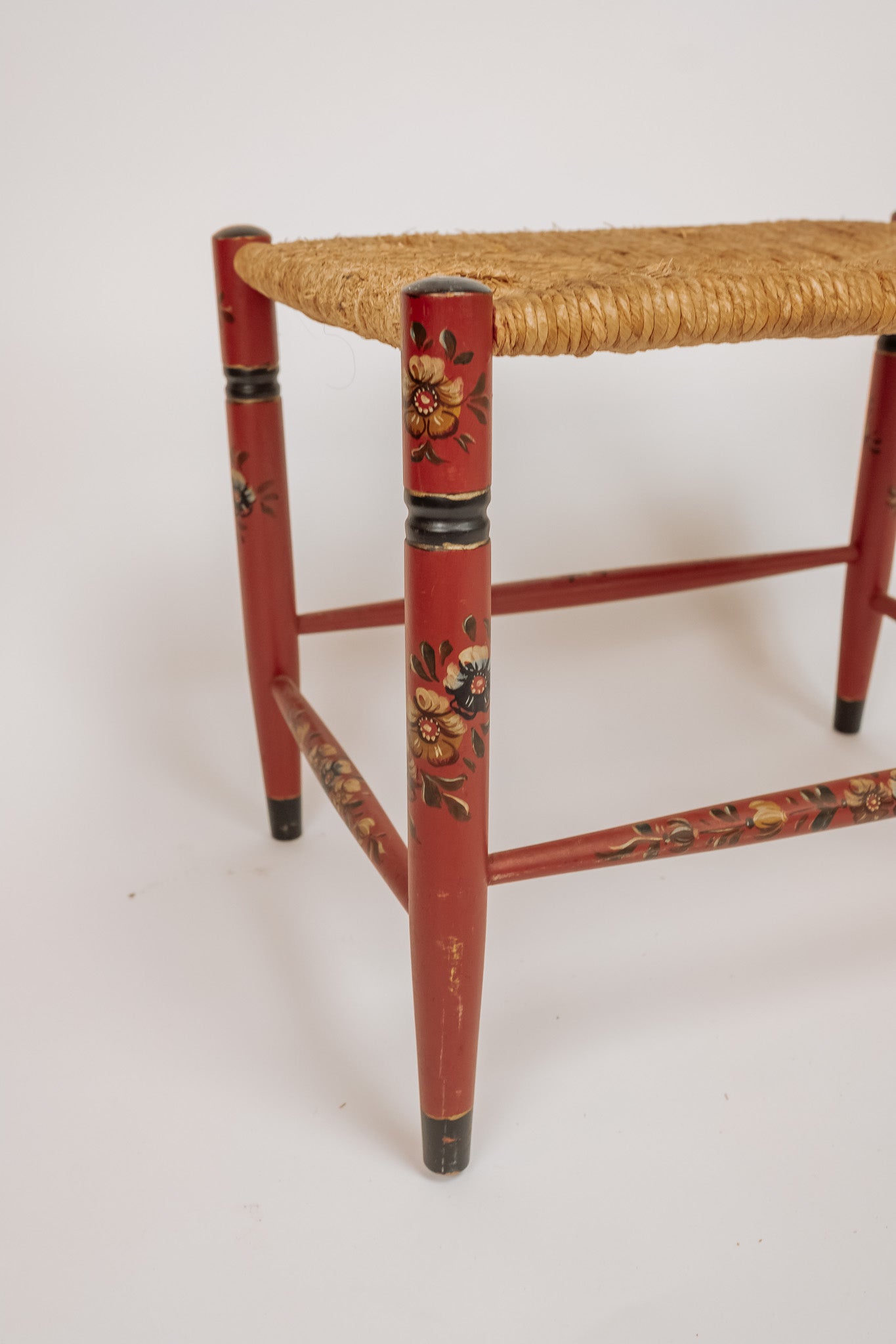 Wooden stool with burgundy papercord seat