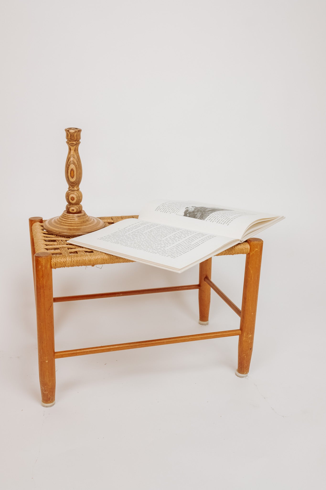 Wooden stool with burgundy papercord seat