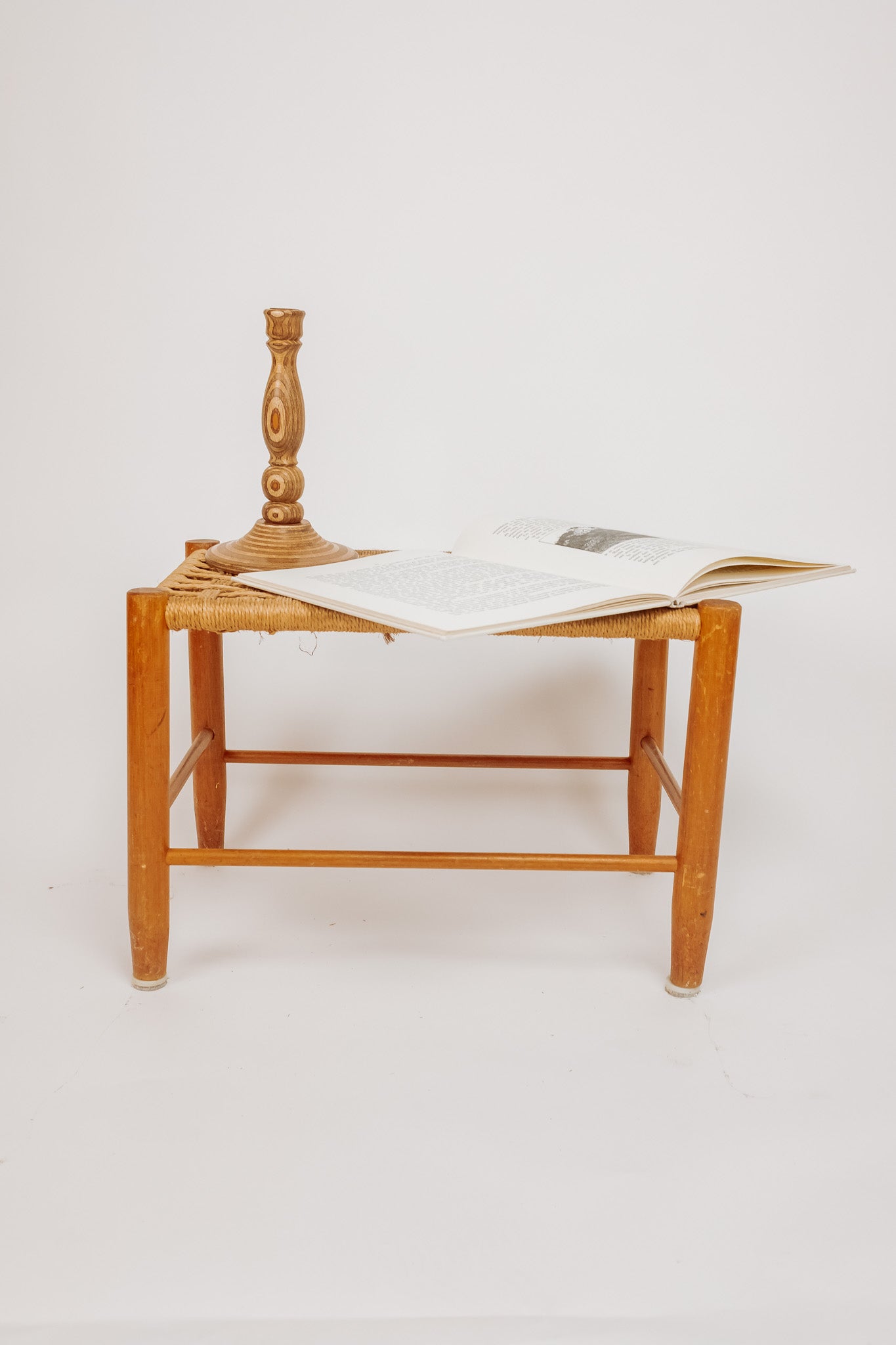 Wooden stool with burgundy papercord seat