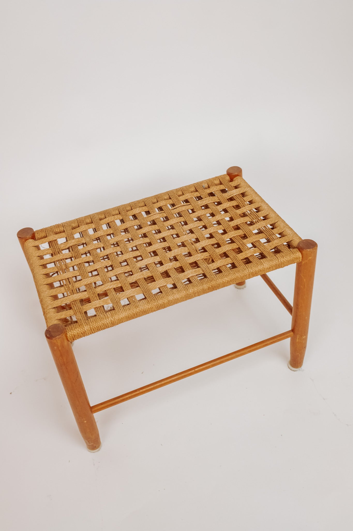 Wooden stool with burgundy papercord seat