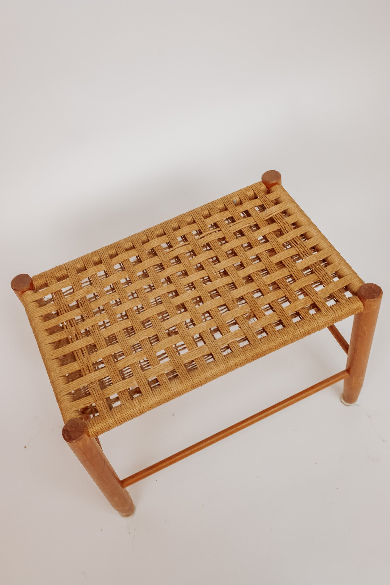 Wooden stool with burgundy papercord seat