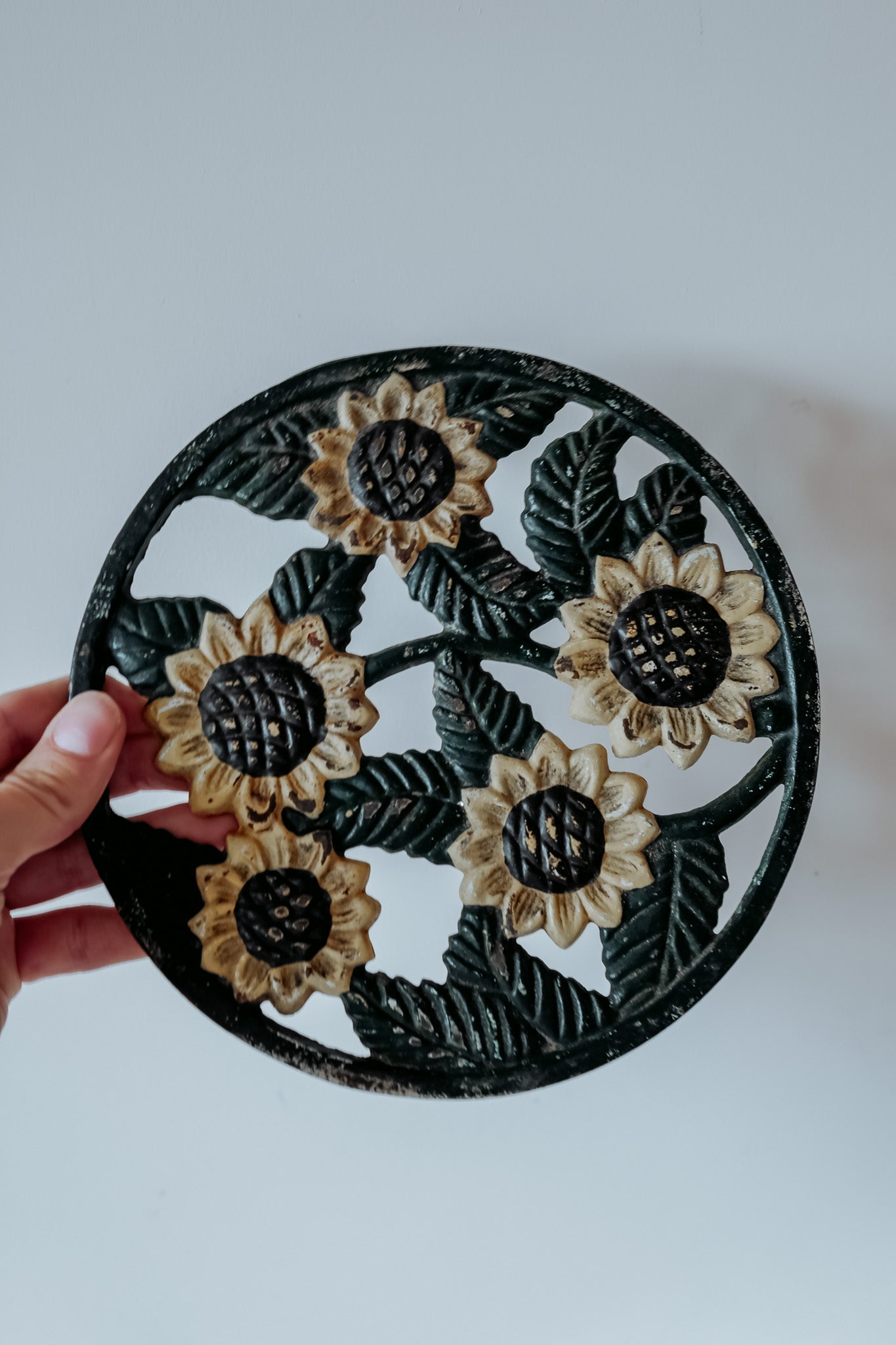 Set van 2 vintage Franse gietijzeren onderzetters