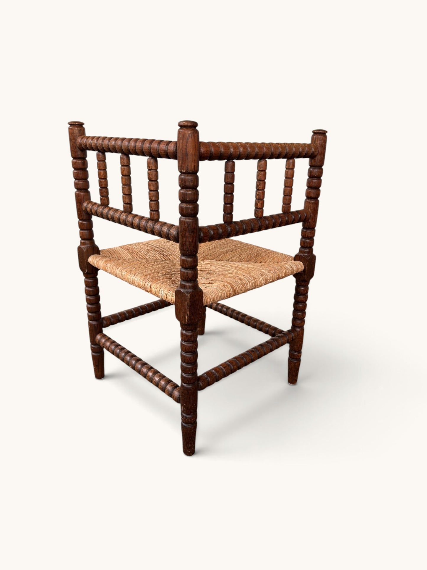 Vintage bobbin hoekstoel van eiken met rieten zitting