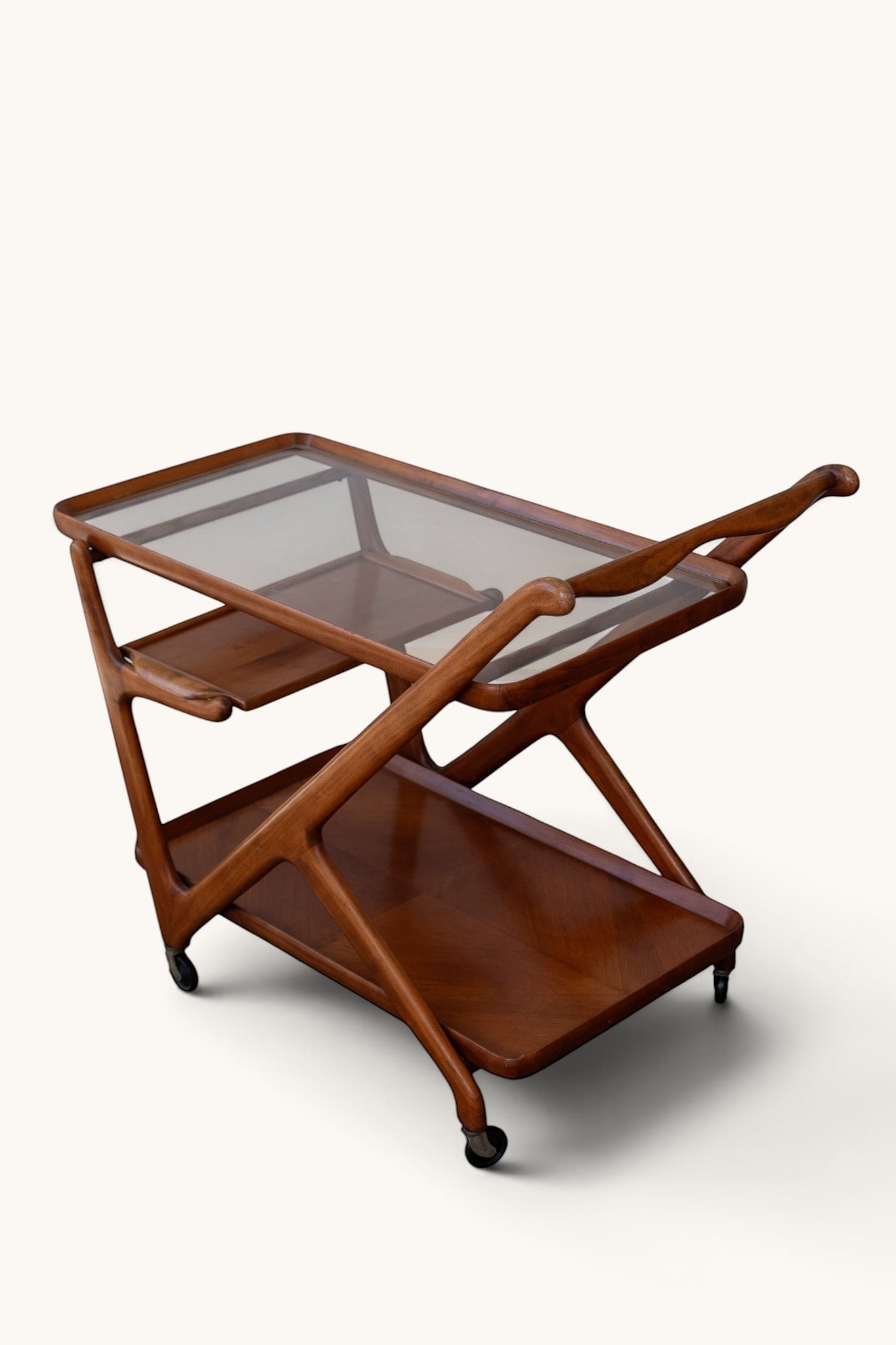 tessvintage mid-century modern Cesare Lacca bar cart in wood and glass with a Z-shaped frame and three tiers.