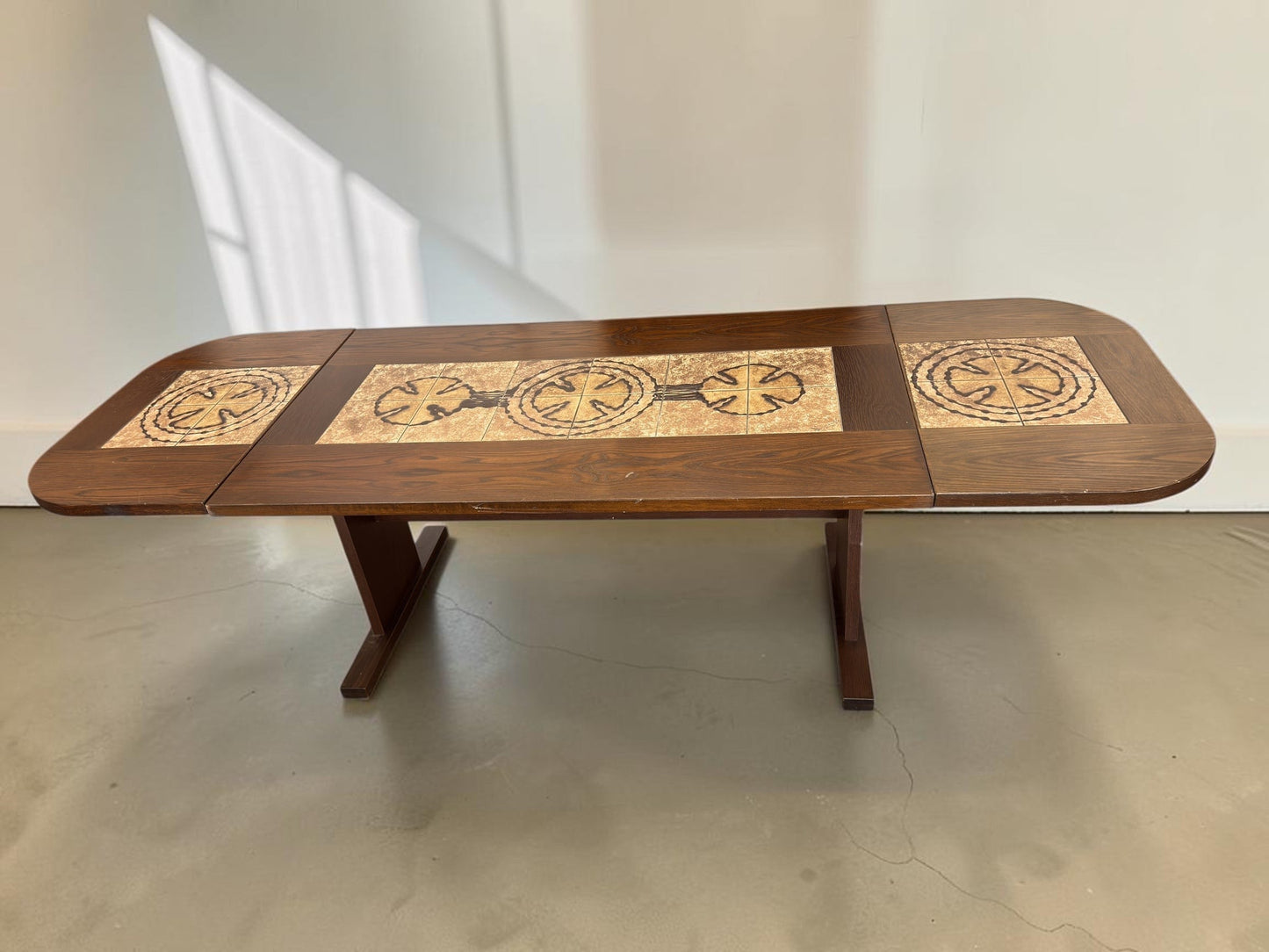 tessvintage Danish extendable dining table by Poul Poulsen with graphic ceramic tile inlay in earthy tones