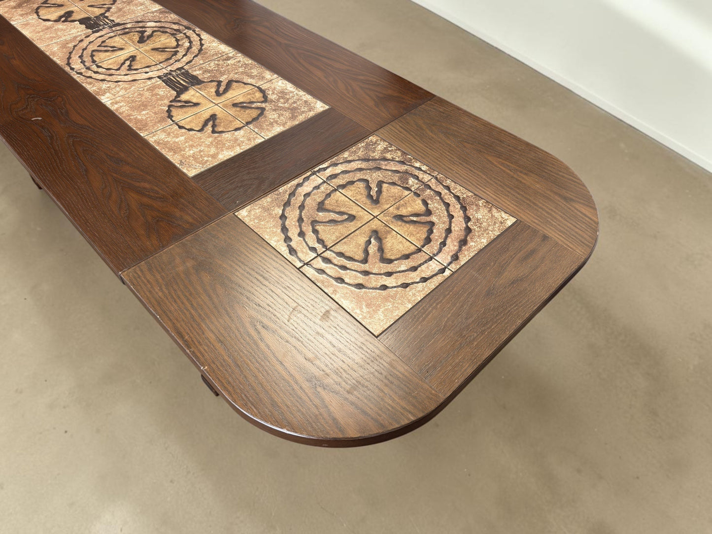tessvintage Poul Poulsen extendable Danish dining table with dark wood and graphic circular ceramic tile inlay