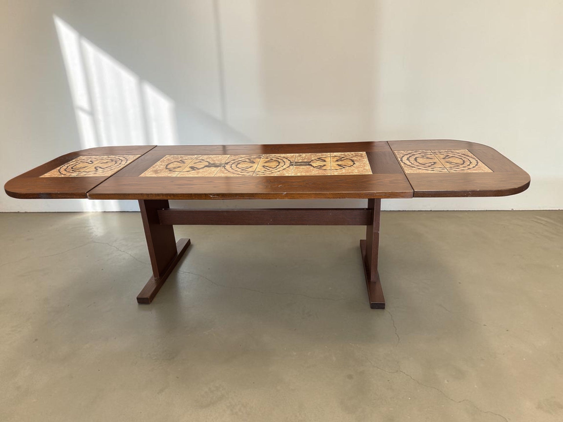 tessvintage Danish extendable dining table by Poul Poulsen with graphic ceramic tile inlay in earthy tones