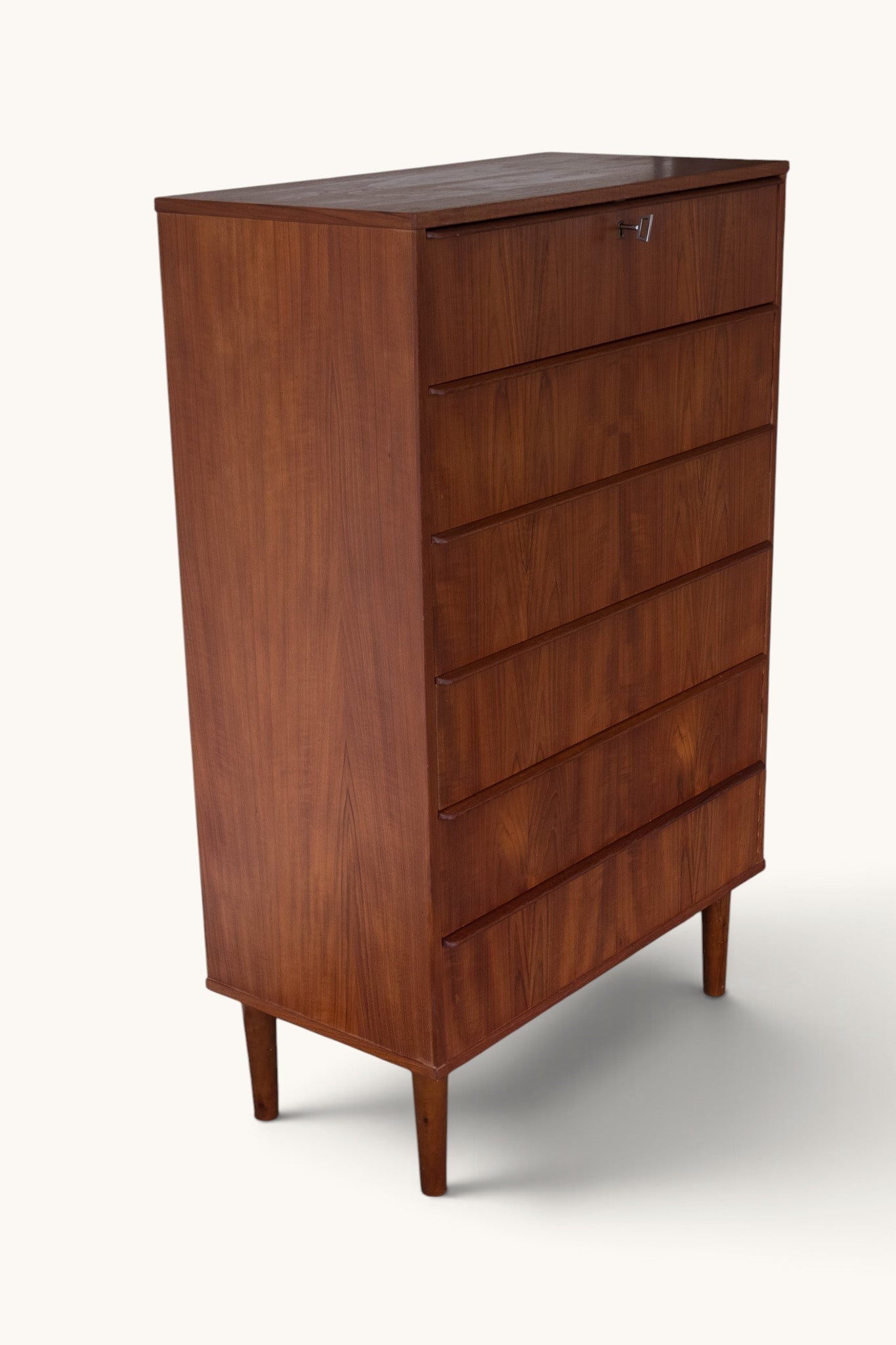 tessvintage vintage Danish teak tallboy chest of drawers with seven drawers and carved wooden handles