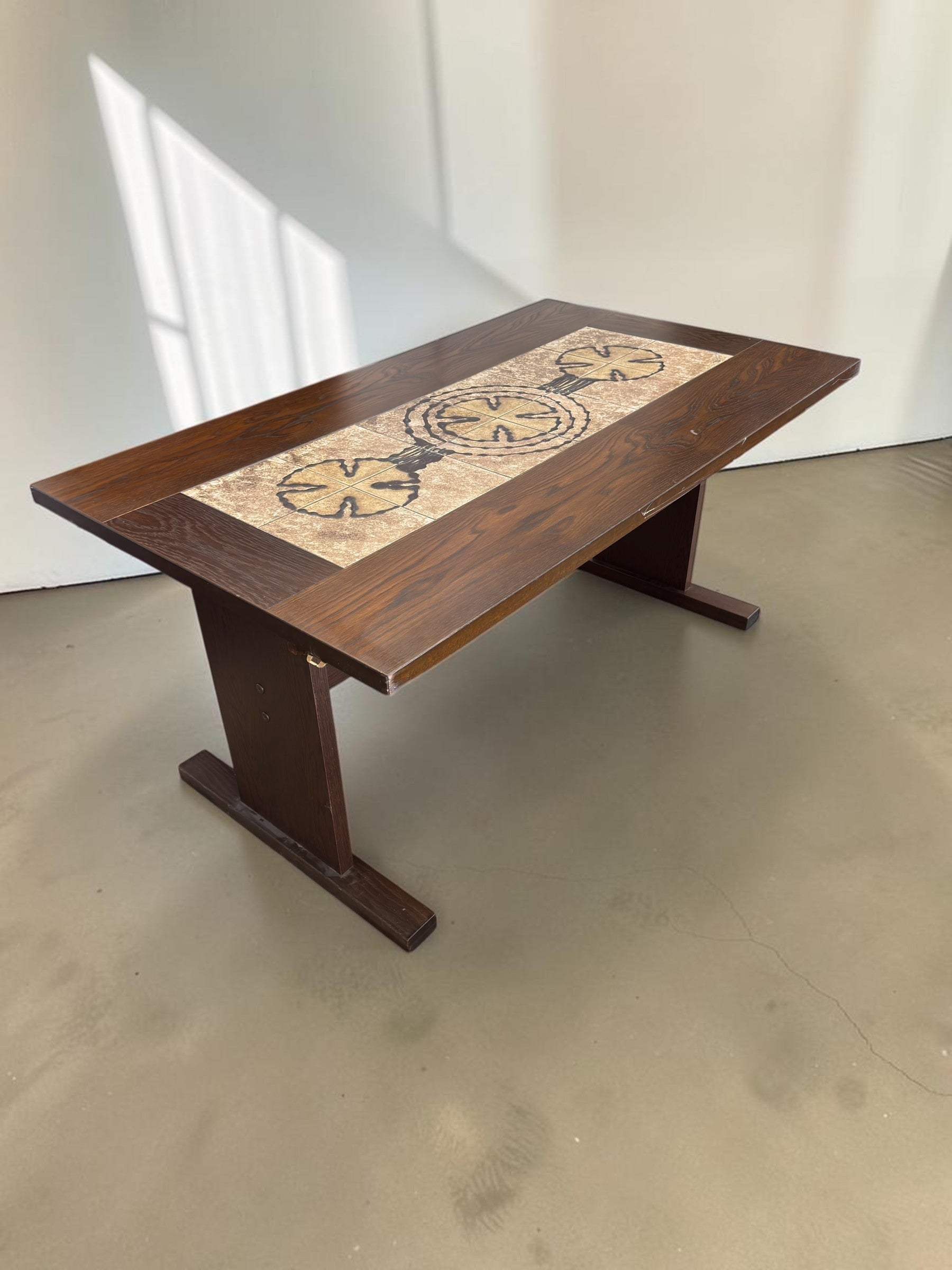 tessvintage Danish extendable dining table by Poul Poulsen with dark wood frame and graphic ceramic tile inlay