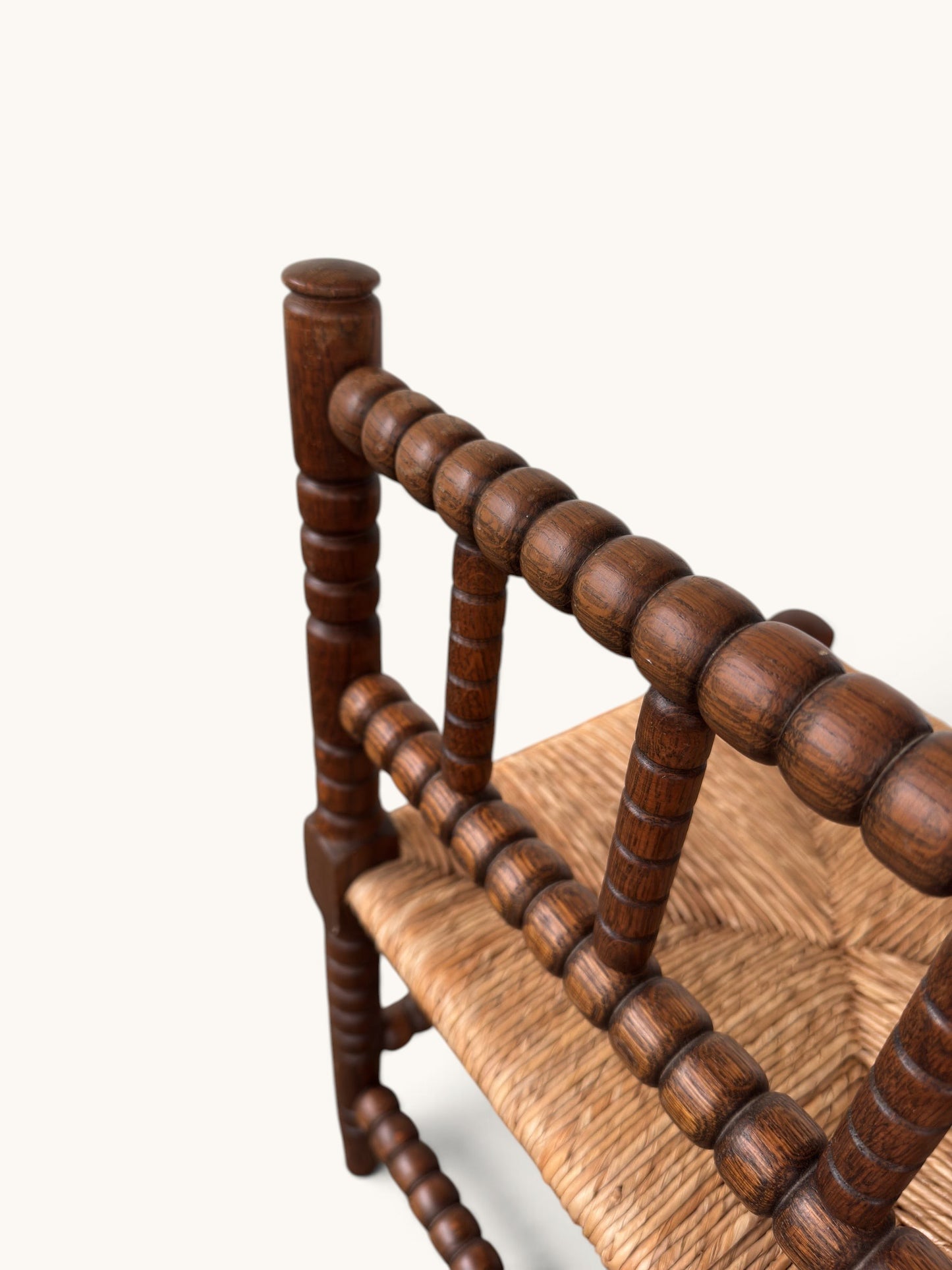 tessvintage vintage oak bobbin corner chair with a detailed woven star pattern rush seat