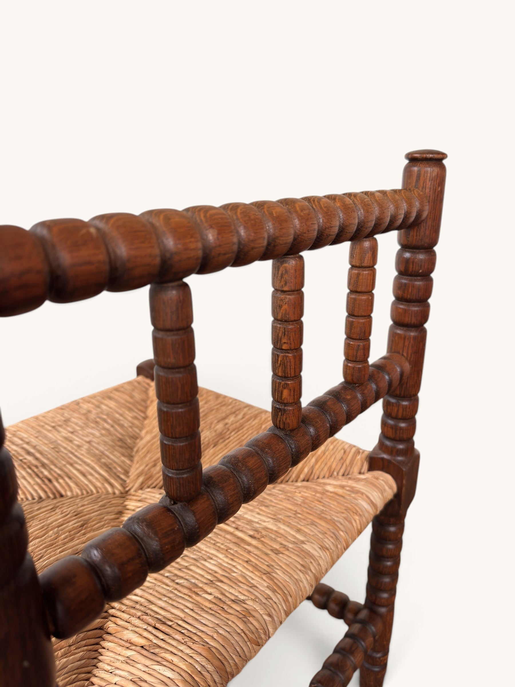 tessvintage vintage oak corner chair with bobbin turned spindles and a woven star-patterned rush seat