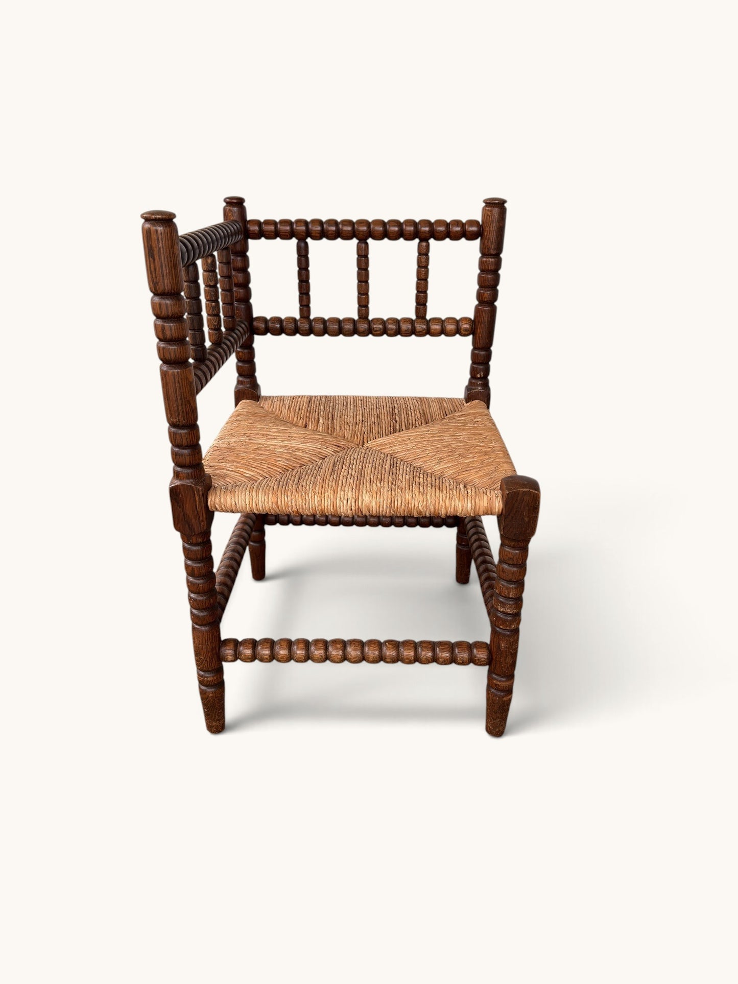 tessvintage vintage oak corner chair with bobbin turned spindles and a woven star-patterned rush seat