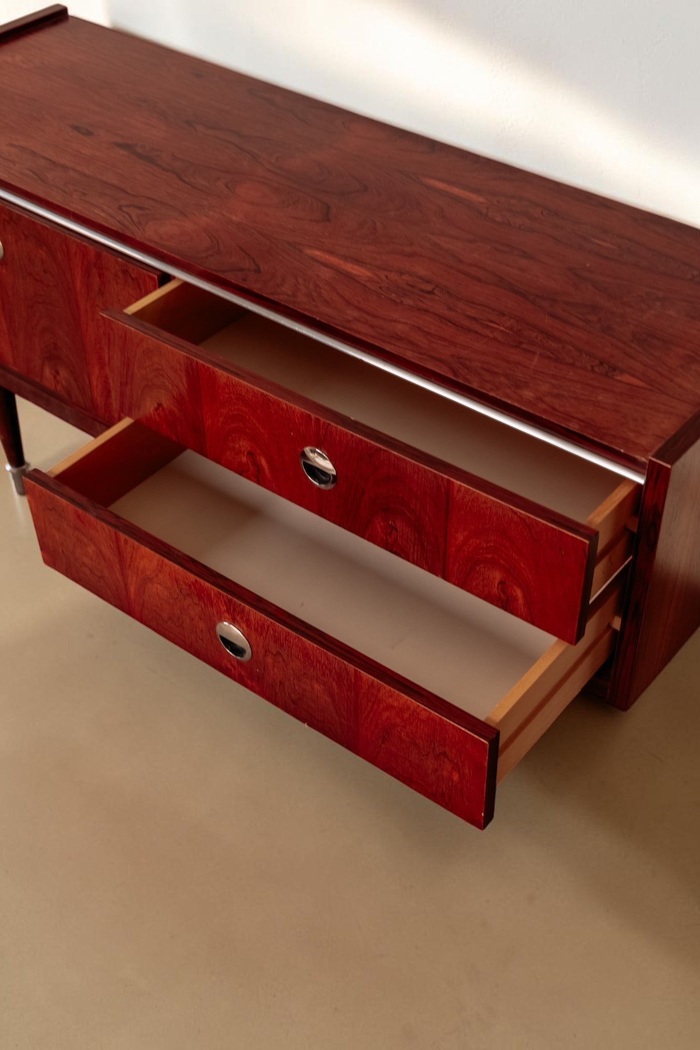 tessvintage 1960s rosewood veneer sideboard with open drawers and round chrome handles