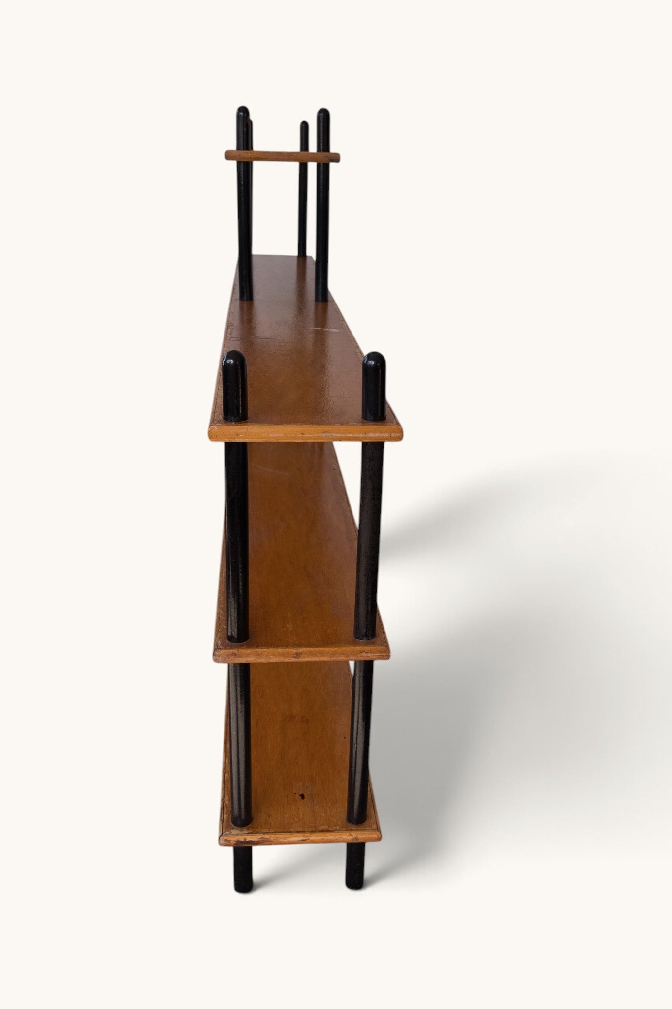 tessvintage 1960s Willem Lutjens wooden shelving unit with black lacquered poles, side profile view
