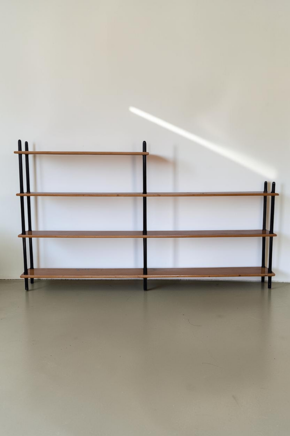 tessvintage 1960s Willem Lutjens wooden shelving unit with black lacquered poles and four tiered shelves